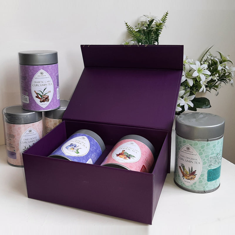 Gift Box with two tea boxes inside and four next to it with white flowers