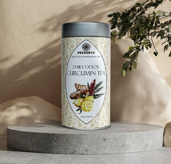 Preserva Wellness Daily Detox Tea is displayed on a Grey round stone slab with a shadowy background