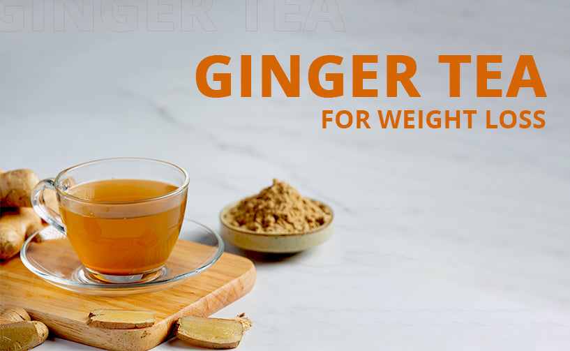 Ginger tea in a glass with sliced ginger and powder