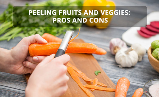 Peeling carrots and vegetables with peeler on a wooden board