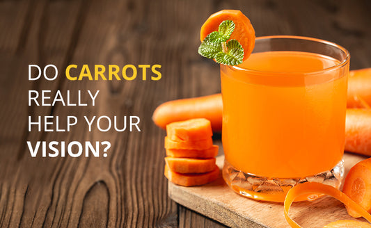 Glass of carrot juice next to slice carrots