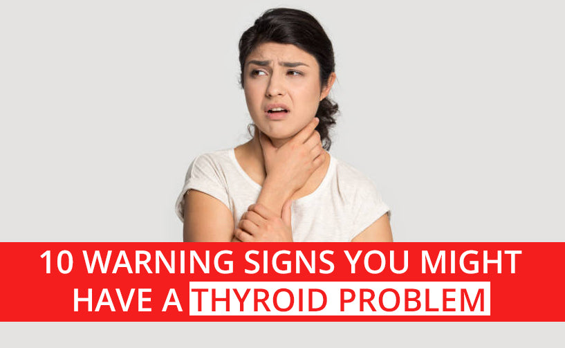 A woman holding her neck due to a thyroid problem