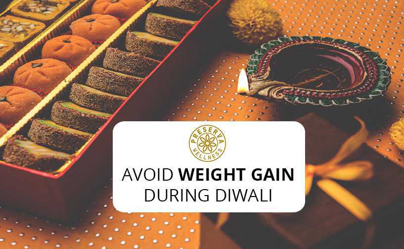 Diwali diya next to sweets and gifts. Text written- Avoid weight gain during Diwali