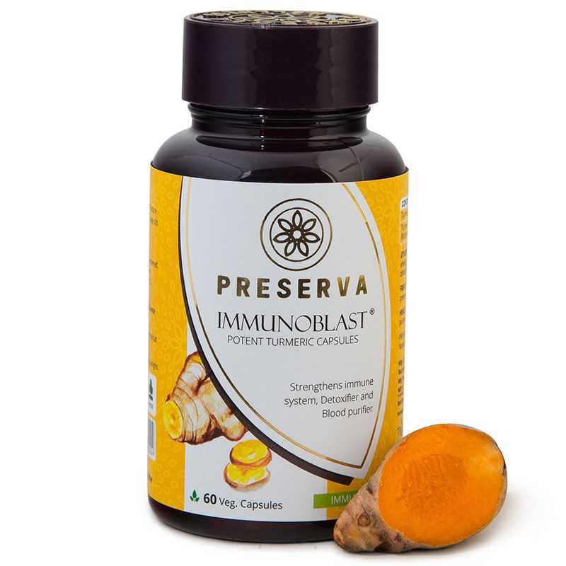 Preserva Wellness Immunoblast Capsules with sliced curcumin on a white background