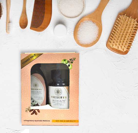 Tressgrow Tablets & Hair Combo Pack on a white background with wooden combs and brushes.