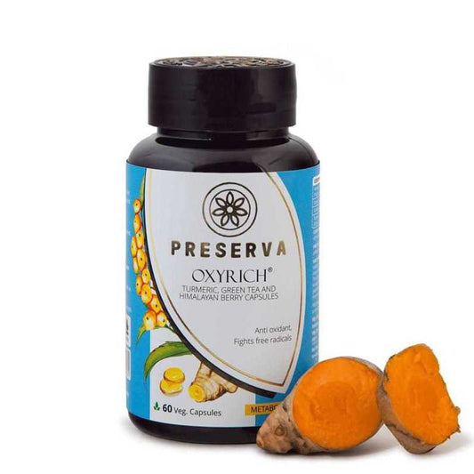 Preserva Wellness Oxyrich Capsules with sliced curcumin on a white background.